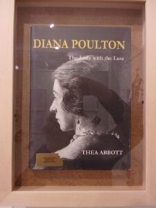 Image of a book with a woman's head on the cover and yellow text