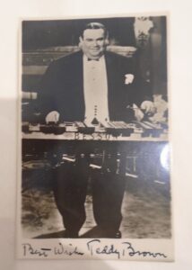 Black and white photograph of a large man in a suit. 
